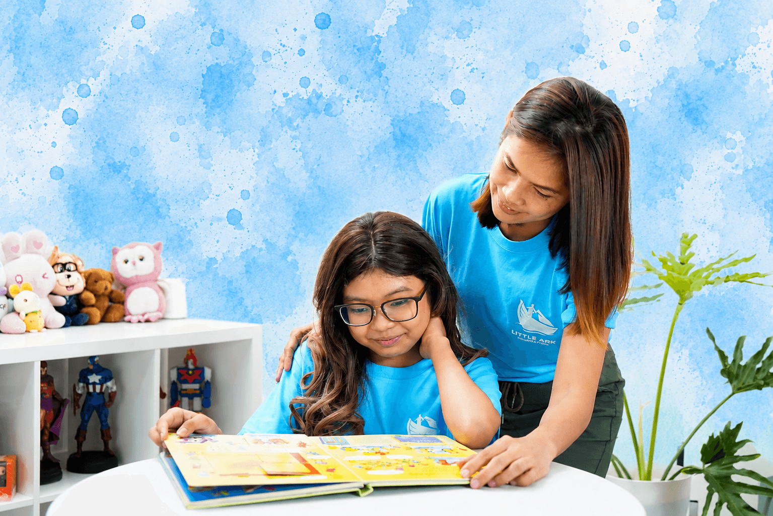 Little Ark Foundation volunteer reading with a child