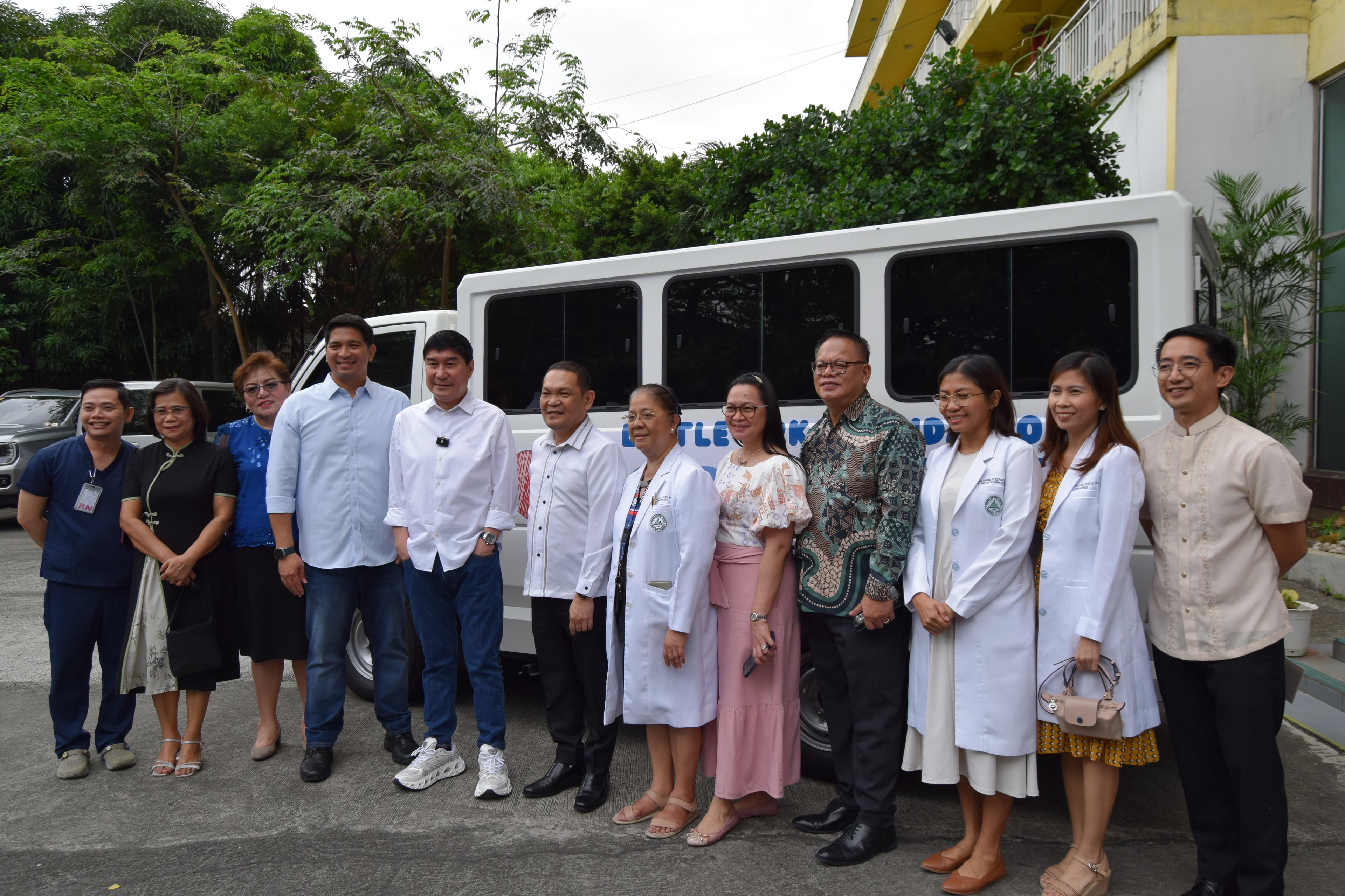 Little Ark transportation partners gathered beside the Hope in Transit shuttle