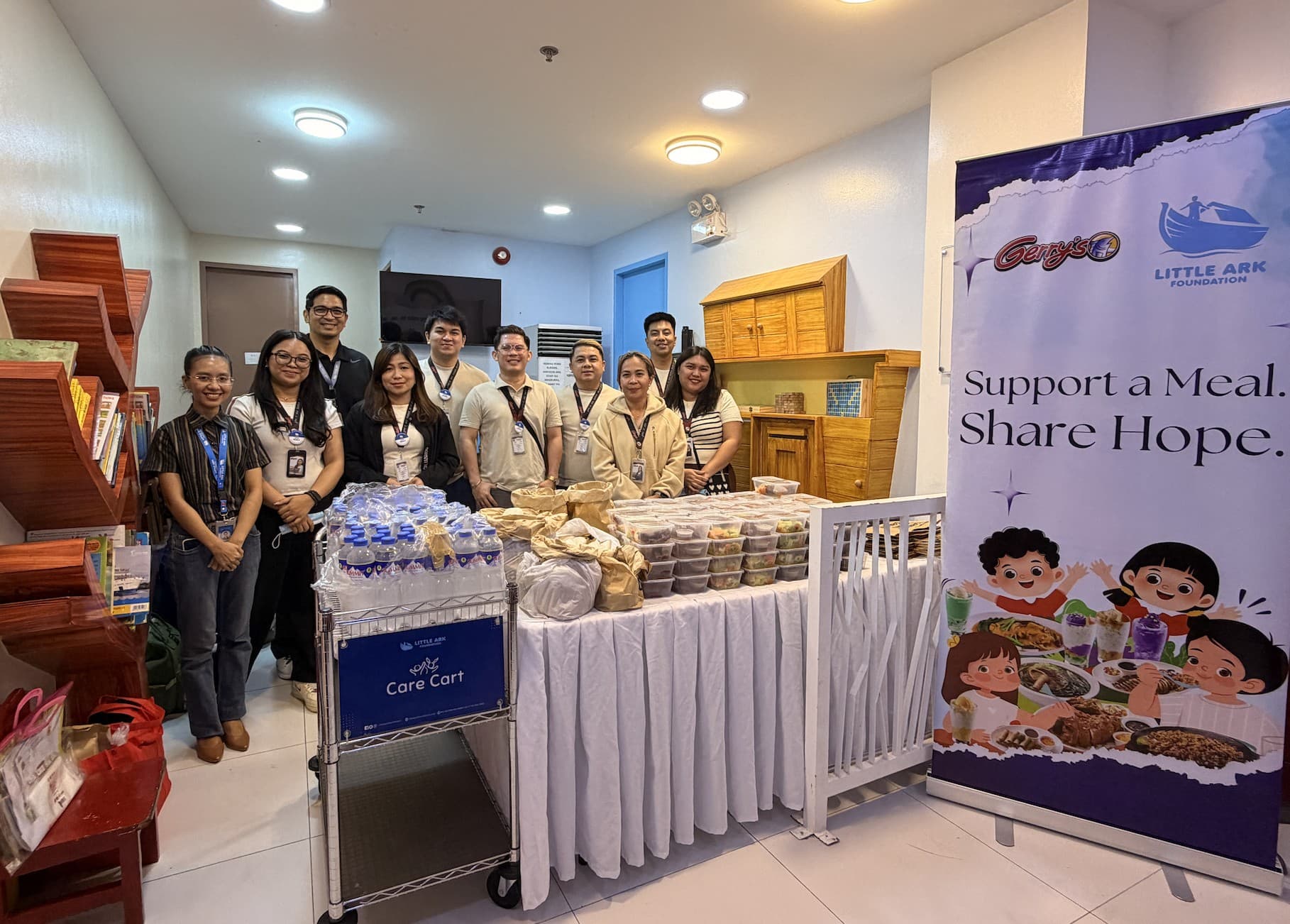 Little Ark Foundation team members gathered with Care Cart meal donations