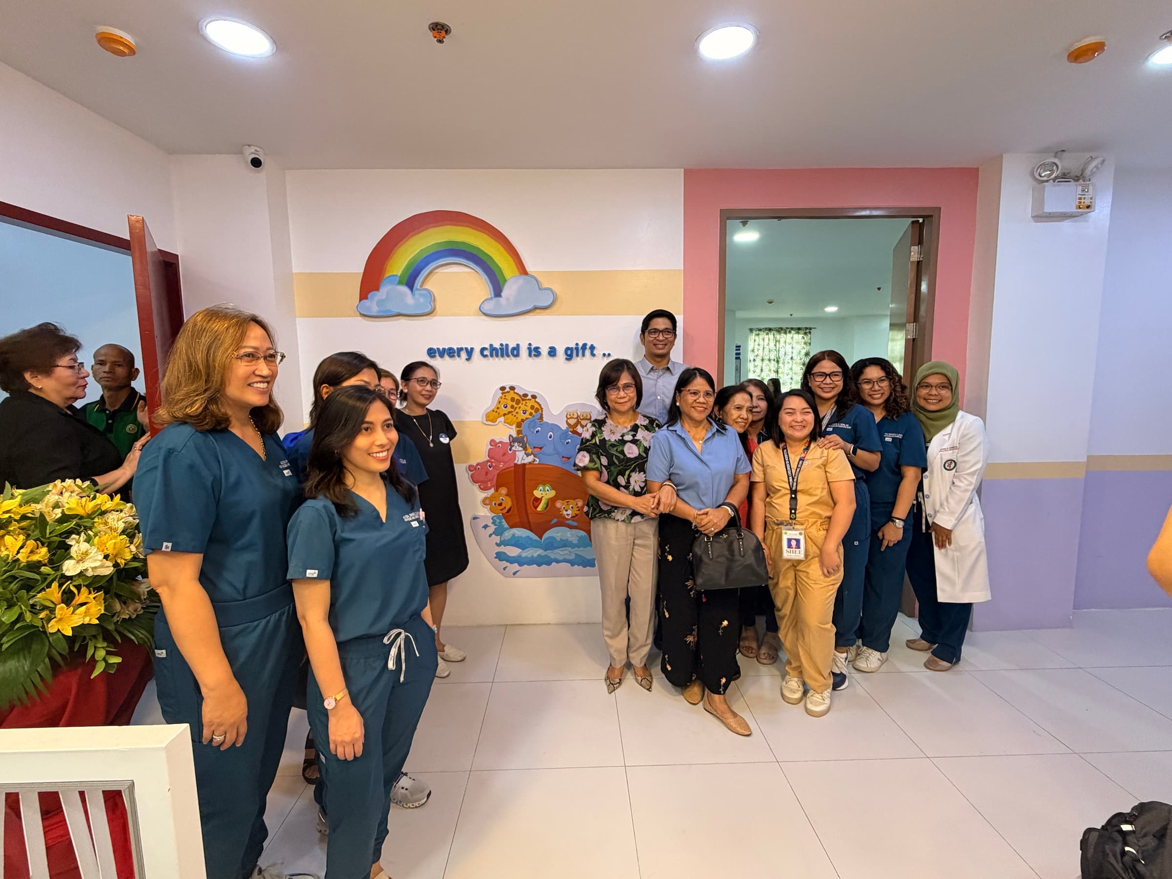 Hospital and Little Ark Foundation representatives gathered inside the LAF Center
