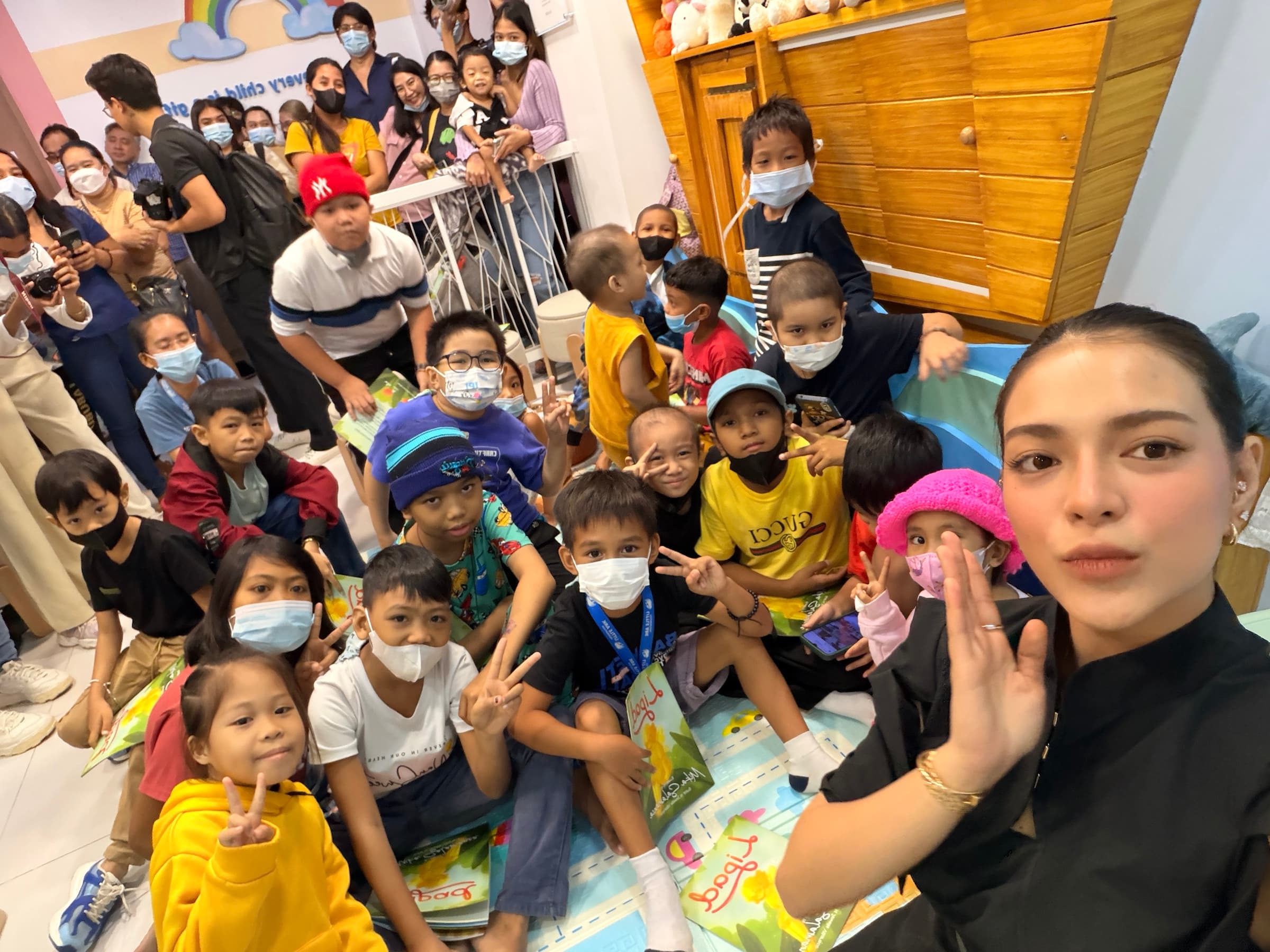 Children and families gathered inside the LAF Center