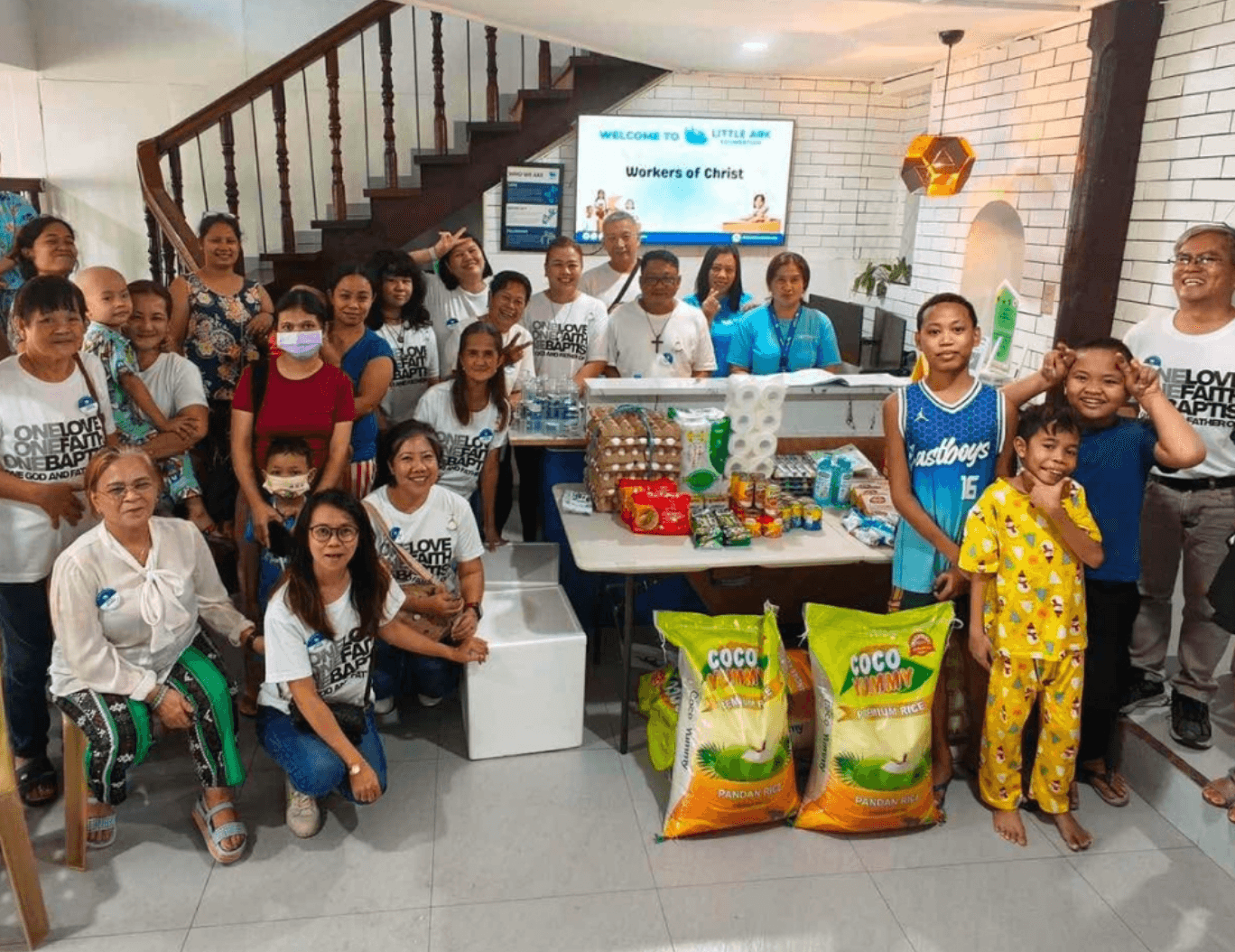 Workers of Christ partners gathered with donated supplies for Little Ark families
