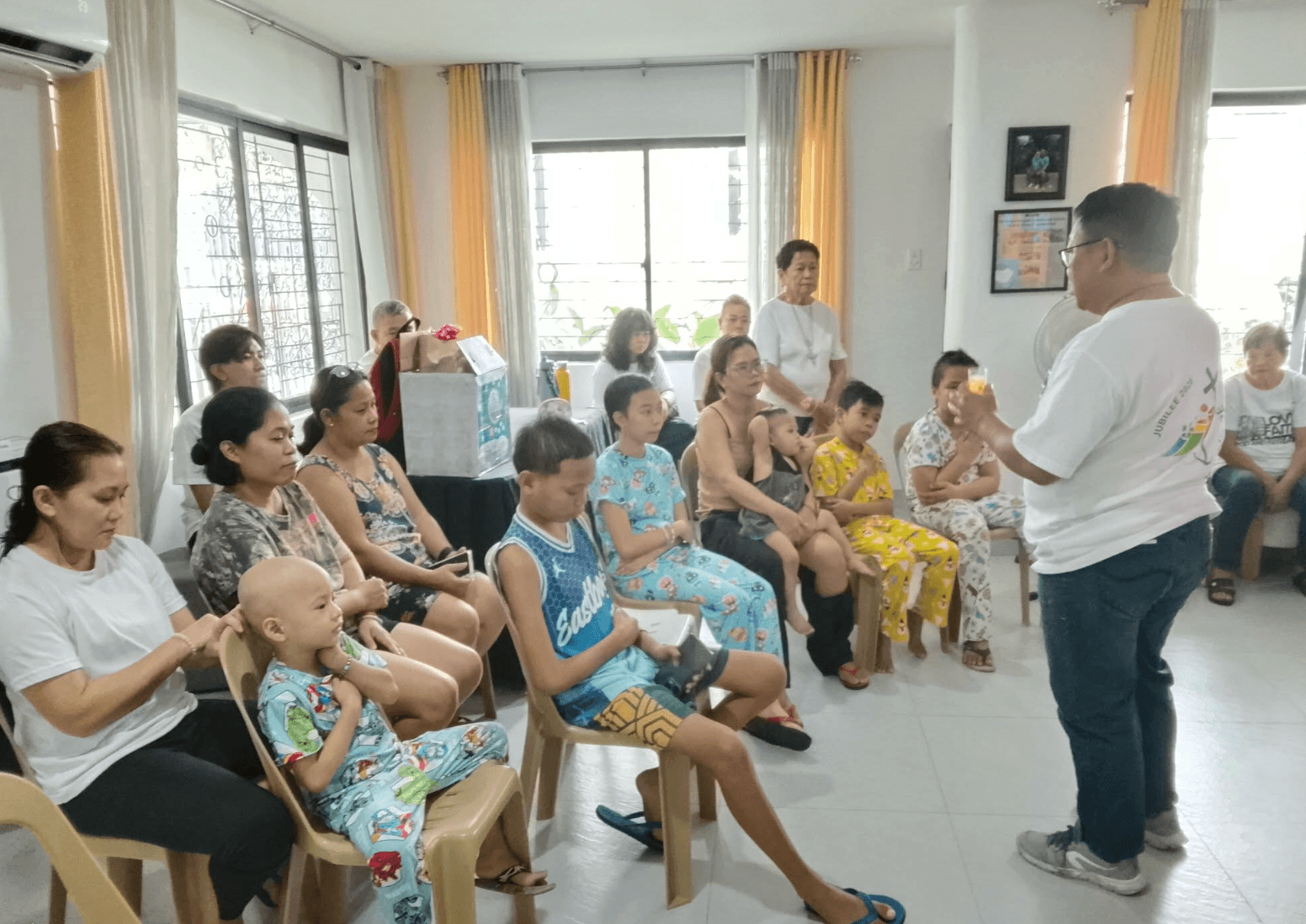 Children and caregivers listening during a Spiritual Care teaching moment