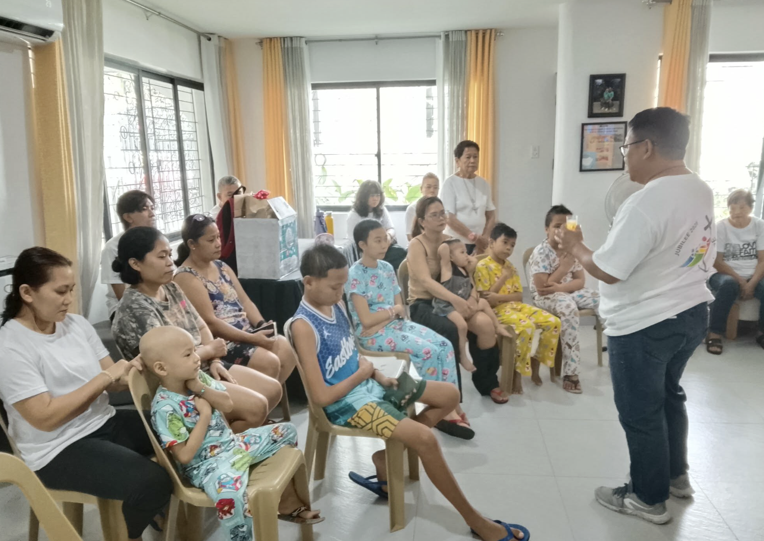 Children and caregivers listening during a Spiritual Care teaching moment